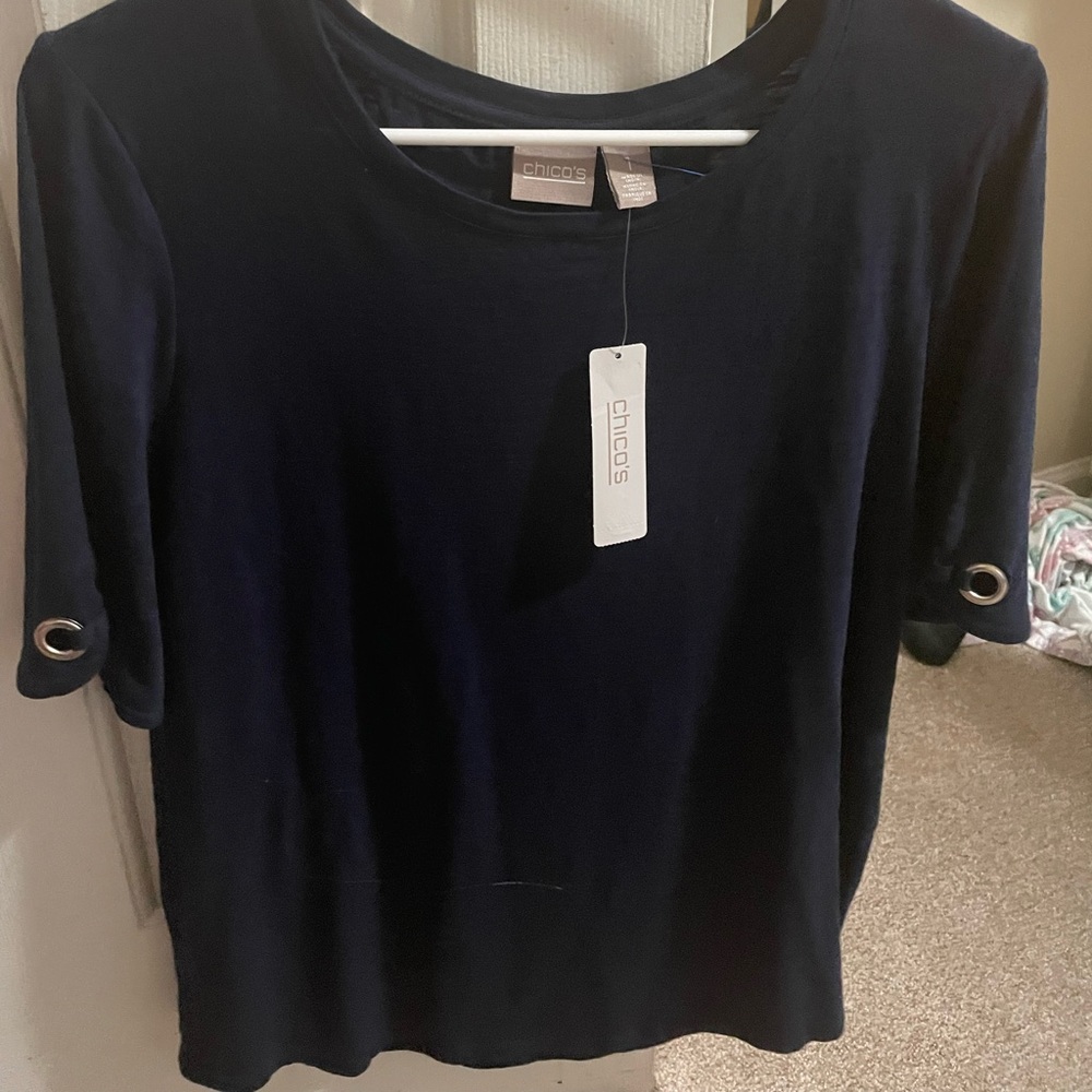 Chico’s navy blouse with silver circles on sleeve. Brand new